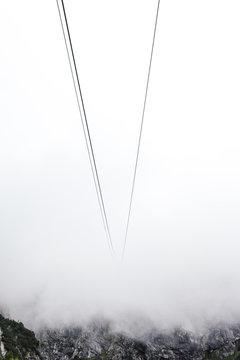 Cable car wires disappearing into mist, Brand, Vorarlberg, Austria