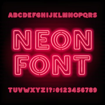Neon tube alphabet font. Red color bold type letters and numbers. Vector typeface for headlines, posters, etc.