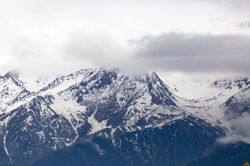 Fototapeta na wymiar Mountain ridge with snowy peaks in Tien Shan