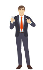 Businessman with mobile phone pointing at himself