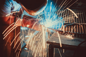 Welding Work. Erecting Technical Steel Industrial Steel Welder In Factory. Craftsman. Soft focus. Shallow DOF.