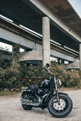 Modern motorcycle on the city urban bridge background. Motorbike on the empty road. Motorcycle tour journey.
