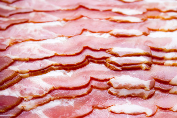 Obraz premium Close-up, background of raw bacon, a popular meat product, ingredient of many dishes.