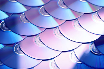Compact discs background. Several cd dvd blu-ray discs. Optical recordable or rewritable digital...