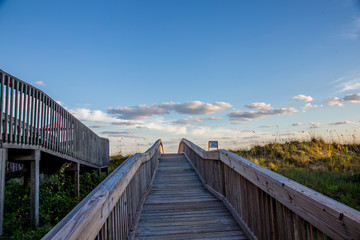 Walkway leading over the dunes to the ocean but seemingly to the sky
