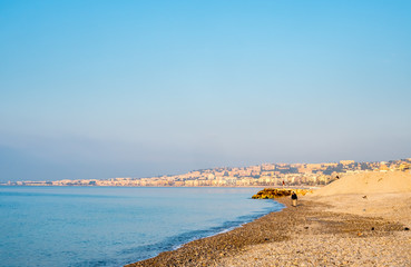 Coast line along Mediterranean sea in Nice, favorite vacation city in France, under morning sunlight