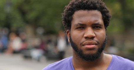 Young black man in city face portrait