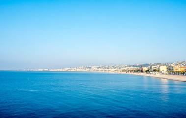 Naklejka na ściany i meble Coast line along Mediterranean sea in Nice, favorite vacation city in France, under morning sunlight
