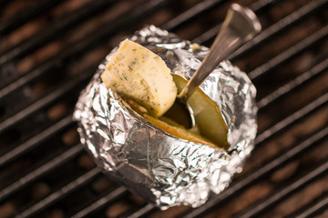 Baked potato on grill