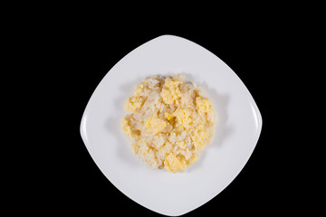 Rice with egg on black isolate, concept of healthy food