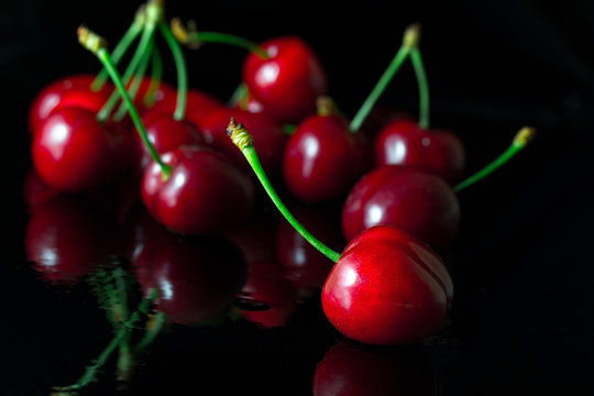 Group of cherries with reflection