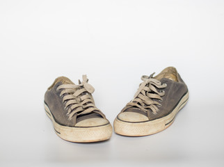 Dirty shoe on isolate white background , close up shoe,dirty blue shoes on the white background , canvas blue shoes