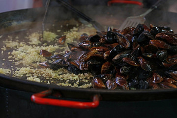 Cooking steamed roasted mussels close up