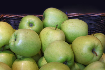 Fresh green apples on retail market close up