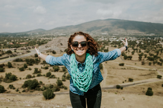 .Young Carefree Female Tourist Enjoying The Pyramids Of Teotihuacan In Mexico. Lifestyle Portrait.