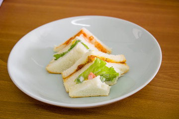 delicious sandwich with ham vegeable bread on  white dish , home made sandwich, health food