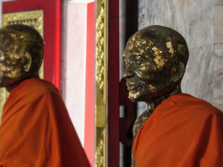 Statues of Buddhist monks.  Statues in a Buddhist temple. 