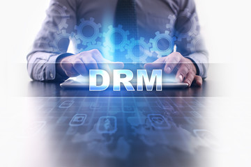 Businessman working with modern tablet pc and selecting drm.