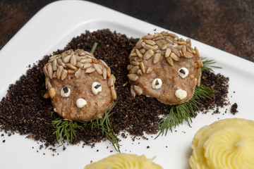 Meat cutlets in hedgehog shape and mashed potato. Kids menu