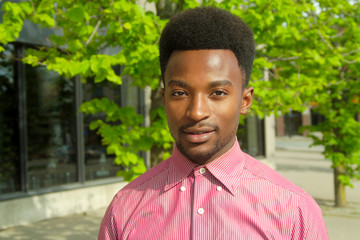 young man on the sidewalk downtown portrait