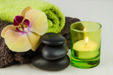 Fototapeta na wymiar spa concept with lava stones, orchid and candle