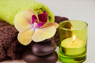Obraz na płótnie Canvas spa concept with lava stones, orchid and candle