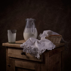 Still life with a jug with yogurt
