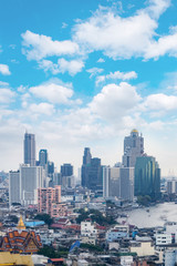 Obraz premium cityscape Bangkok skyline, Thailand. Bangkok is metropolis and favorite of tourists live at between modern building / skyscraper, office building and Community residents with blue sky and cloud