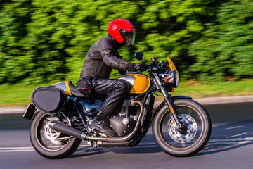 Fototapeta na wymiar Rider on his street-style motorbike 