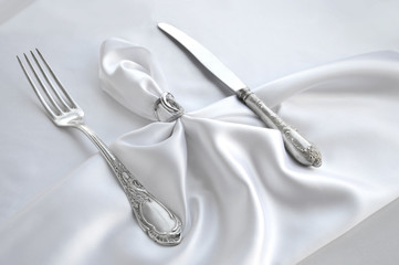Vintage cutlery on white lace