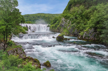Natural landscape of exceptional beauty. This is a typical karst spring of upward type, of special green-blue color. Strbacki buk - largest waterfall on the Una river. Bosnia and Herzegovina, Una NP