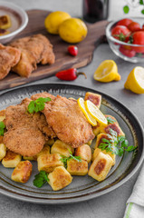 Schnitzel original with lemon and gnocchi fried