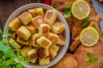 Schnitzel original with lemon and gnocchi fried