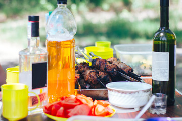 barbecue on table with wine beer nature