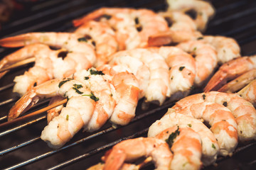 barbecue in the garden - summer- prawns and vegetables on skewers