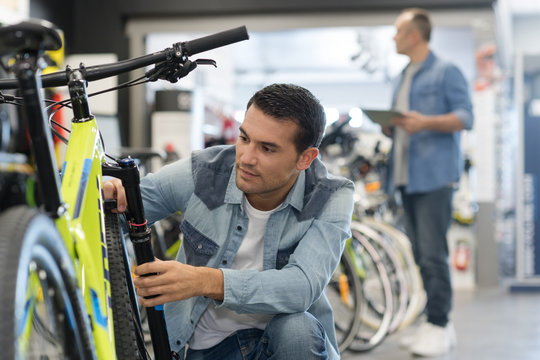 inspecting the bike