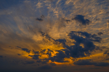 Naklejka na ściany i meble Fiery sunset with clouds