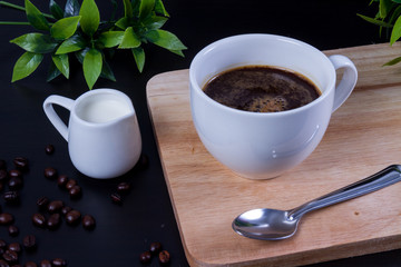 Hot coffee and milk on wood