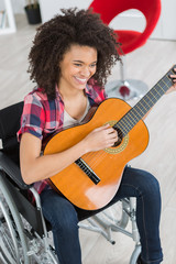 the happy woman with a guitar