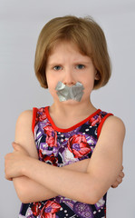 Sealed mouth of the child,protest,silence.Concept of forbidden opinion.