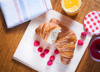 delicious continental breakfast of orange juice and croissants