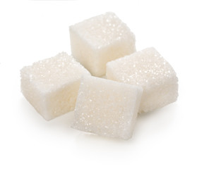 Cubes of lump sugar isolated on a white background.