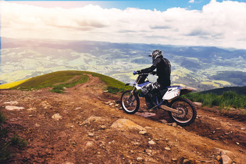 Carpathian mountains in Ukraine.Man rides a motorcycle in the mountains. Mountain range in summer Green mountain,mountain peak, mountain landscape.