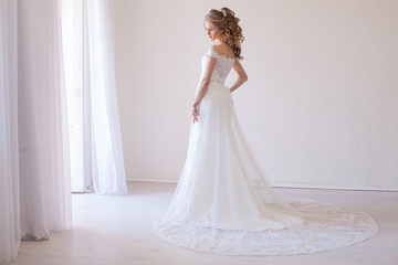 tender bride in a white room before the wedding