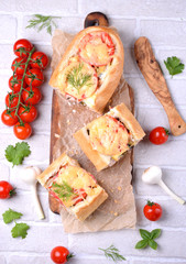 Bread baked with smoked sausage, mushrooms, onions, cheese, tomatoes and pickled cucumbers.