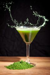 Young barley and chlorella spirulina, water splash. Detox superfood.