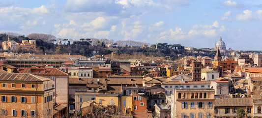 Fototapeta na wymiar Italy, Rome, view from the Aventine Hill to the Gianiculum Hill, Trastevere, the Garibaldi Monument and St. Peter's Cathedral in the Vatican