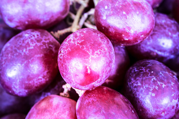 Close up fresh red grape background