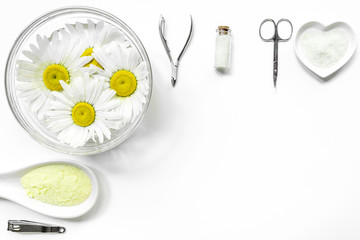 Spa composition with salt, chamomile and manicure set copyspase top view white background