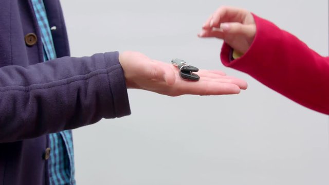 The man hands over the keys